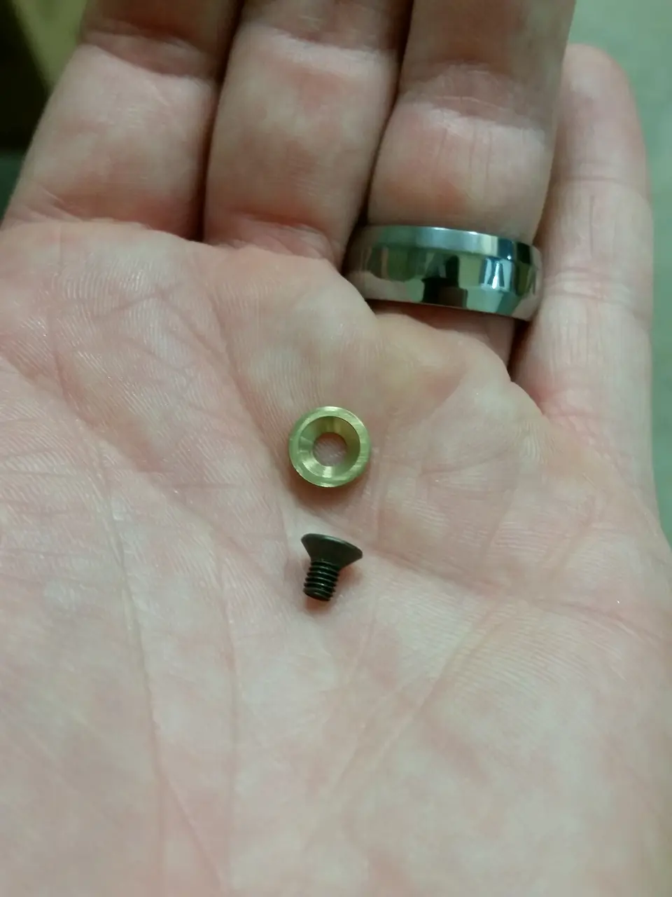Small reverse-engineered part in hand