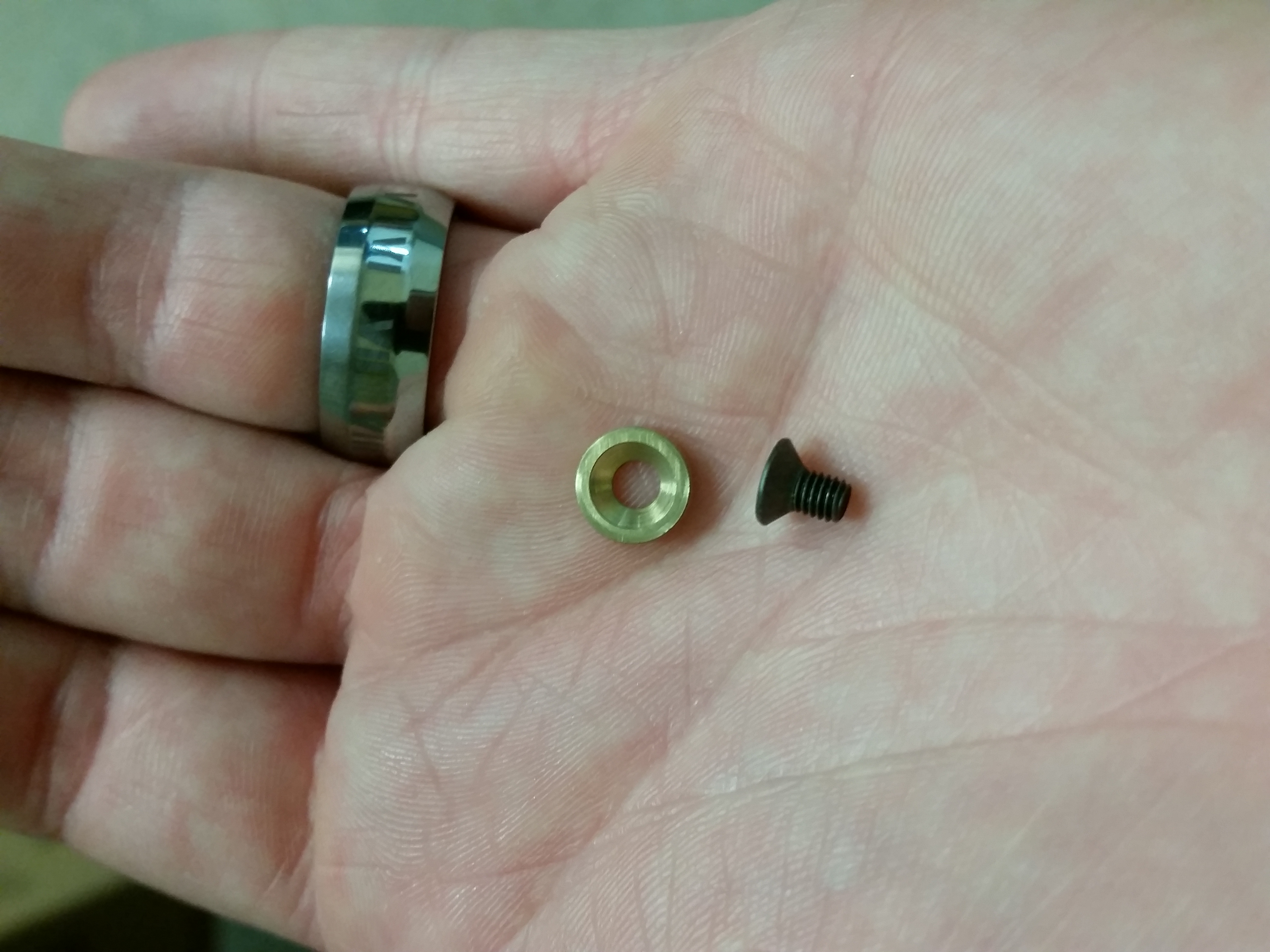 Small reverse-engineered part in hand