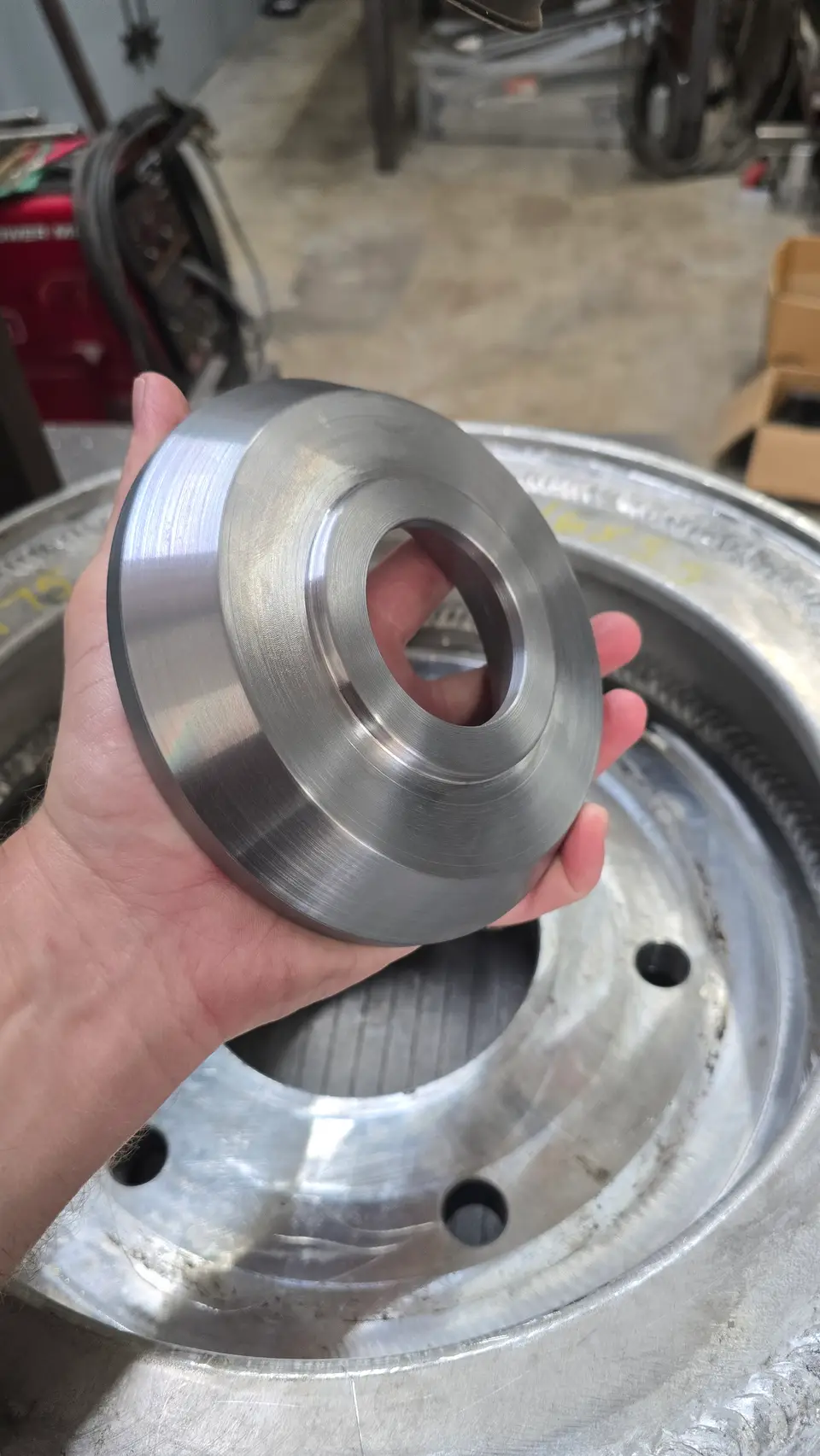 Finished machined flange held at the JDA bench